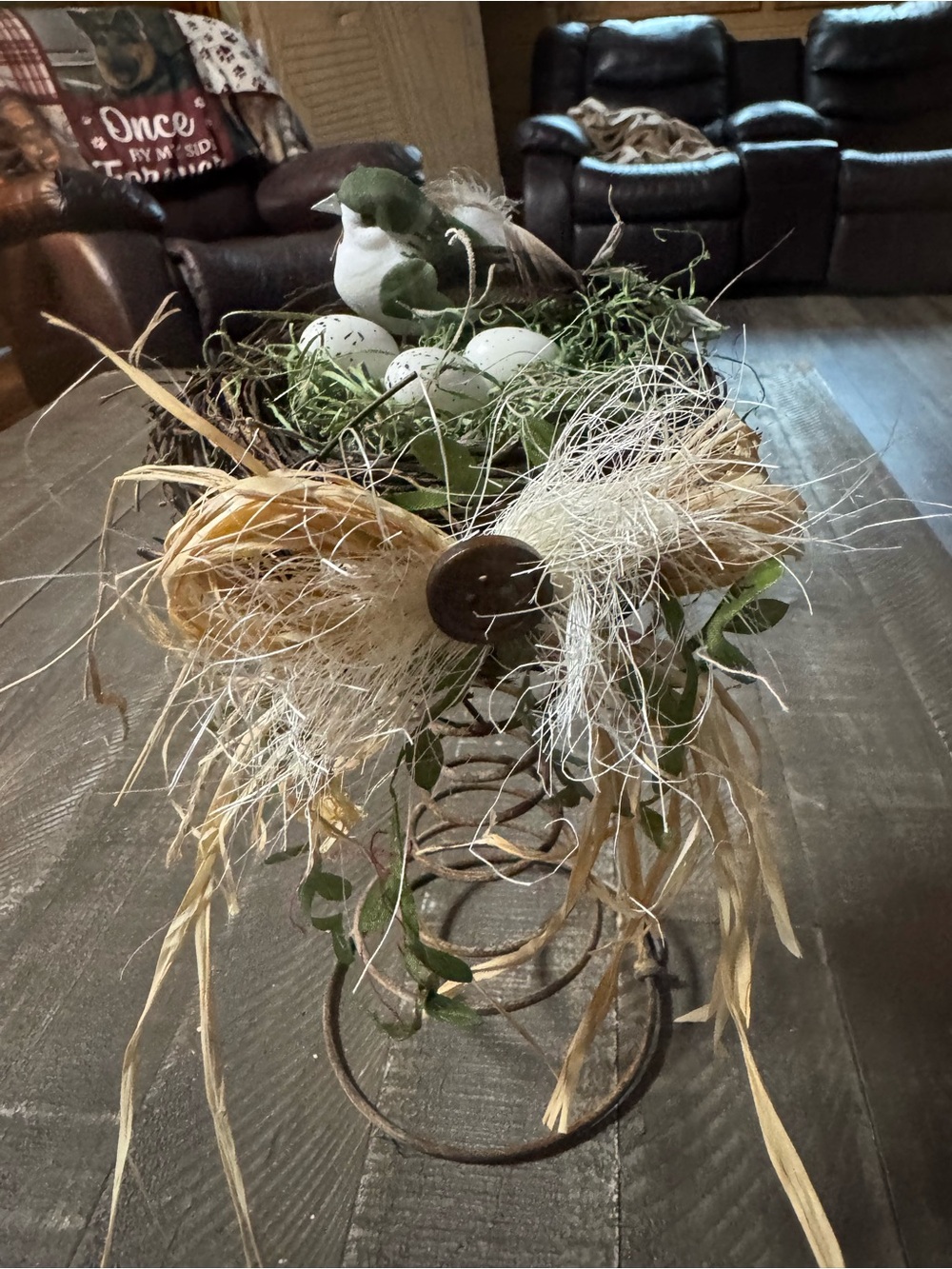 Green & White Bird Nest Table Accent with Raffia Bow on a rusty bedspring